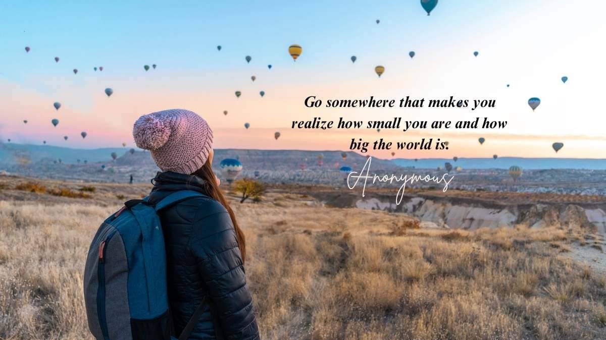 Unique travel quote over a sunset background with mountains in the distance, symbolizing adventure and self-discovery.